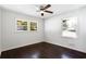 Bright bedroom with dark hardwood floors and ceiling fan at 504 Milligan Dr, Stone Mountain, GA 30083