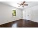 Bedroom with hardwood floors, ceiling fan and double closets at 504 Milligan Dr, Stone Mountain, GA 30083