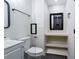 Clean bathroom with glass shower and built-in shelving at 504 Milligan Dr, Stone Mountain, GA 30083