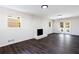 Living room with fireplace, hardwood floors, and access to patio at 504 Milligan Dr, Stone Mountain, GA 30083