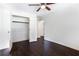 Bright bedroom with dark hardwood floors and a spacious closet at 504 Milligan Dr, Stone Mountain, GA 30083