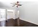 Main bedroom with dark hardwood floors and ensuite bathroom at 504 Milligan Dr, Stone Mountain, GA 30083