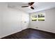 Bedroom with dark hardwood floors and a ceiling fan at 504 Milligan Dr, Stone Mountain, GA 30083