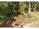 Small creek running through the backyard at 504 Milligan Dr, Stone Mountain, GA 30083