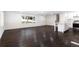 Spacious living room with hardwood floors and an open concept kitchen at 504 Milligan Dr, Stone Mountain, GA 30083