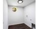 Bright laundry room with dark wood flooring at 504 Milligan Dr, Stone Mountain, GA 30083