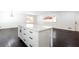 Kitchen island with white cabinets and quartz countertops at 504 Milligan Dr, Stone Mountain, GA 30083