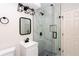 Modern bathroom with marble shower and black accents at 504 Milligan Dr, Stone Mountain, GA 30083