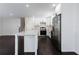 Updated kitchen with white shaker cabinets and stainless steel appliances at 504 Milligan Dr, Stone Mountain, GA 30083