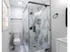 Modern bathroom with frameless glass shower and marble tile at 504 Milligan Dr, Stone Mountain, GA 30083