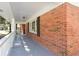 Spacious front porch with brick exterior at 504 Milligan Dr, Stone Mountain, GA 30083