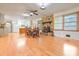 Bright dining room featuring hardwood floors and a stone fireplace at 1189 E Fayetteville Rd, Riverdale, GA 30296