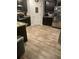 Modern kitchen with dark cabinets, granite countertops, and wood flooring at 3035 Chris Cir, Villa Rica, GA 30180