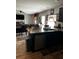 Open concept kitchen with granite island and stainless steel appliances at 3035 Chris Cir, Villa Rica, GA 30180