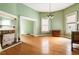 Charming dining room with hardwood floors, fireplace, and large windows at 668 Peeples Sw St, Atlanta, GA 30310