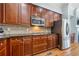 Modern kitchen with dark wood cabinets, granite countertops, and stainless steel appliances at 2380 Crescent Park Ct # 4, Atlanta, GA 30339