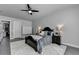 Charming bedroom with dark wood bed frame and plush rug at 5855 Windjammer Pt, Cumming, GA 30041