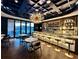 Elegant bar with a stunning chandelier and high-end finishes at 185 Roycroft Ln, Fayetteville, GA 30214