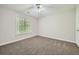 Bright bedroom with neutral walls, carpet, ceiling fan and window at 2459 Jacks View Ct, Snellville, GA 30078