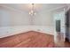Formal dining room with hardwood floors and chandelier at 2459 Jacks View Ct, Snellville, GA 30078