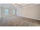 Large main bedroom with ceiling fan and neutral carpet at 2459 Jacks View Ct, Snellville, GA 30078