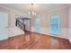 Formal dining room with hardwood floors and chandelier, view of entryway at 2459 Jacks View Ct, Snellville, GA 30078