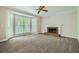 Spacious living room with brick fireplace and large windows at 2459 Jacks View Ct, Snellville, GA 30078