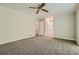 Open living room with neutral carpet and access to kitchen at 2459 Jacks View Ct, Snellville, GA 30078