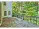 Wooden deck with leafy trees in the background at 2459 Jacks View Ct, Snellville, GA 30078