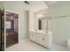 Double vanity bathroom with access to bedroom at 2459 Jacks View Ct, Snellville, GA 30078