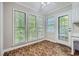 Bright breakfast nook features tile flooring and a view to the backyard at 2459 Jacks View Ct, Snellville, GA 30078