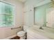 Clean bathroom with single sink vanity and window at 2459 Jacks View Ct, Snellville, GA 30078