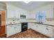 Kitchen with white cabinets, tile floor, and stainless steel appliances at 2459 Jacks View Ct, Snellville, GA 30078