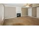 Spacious living room featuring a fireplace and neutral color palette at 732 Jockey Ln, Auburn, GA 30011
