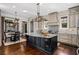 Gourmet kitchen boasts granite counters, island, and stainless steel appliances at 47 Waterside Se Dr, Cartersville, GA 30121