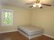 Bedroom with hardwood floors and ceiling fan at 2107 Briarwood Ct, Snellville, GA 30078