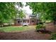 Brick house with a large backyard and deck at 929 Thousand Oaks Nw Bnd, Kennesaw, GA 30152