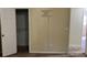 Bedroom with closet and damaged wall at 6883 Lakeshore Dr, Douglasville, GA 30135