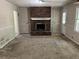 Shows the living room with a brick fireplace at 6883 Lakeshore Dr, Douglasville, GA 30135