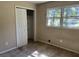Bedroom with double door closet and window at 6883 Lakeshore Dr, Douglasville, GA 30135