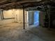 Unfinished basement area with concrete floor at 6883 Lakeshore Dr, Douglasville, GA 30135