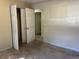 Bedroom with double door closet and hallway access at 6883 Lakeshore Dr, Douglasville, GA 30135