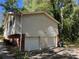 Two-car garage with white doors at 6883 Lakeshore Dr, Douglasville, GA 30135