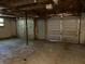 Unfinished double-car garage in basement at 6883 Lakeshore Dr, Douglasville, GA 30135