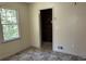 Image of a bedroom with a window and a brick closet at 6883 Lakeshore Dr, Douglasville, GA 30135