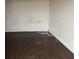 Unfinished small basement room with dark flooring at 6883 Lakeshore Dr, Douglasville, GA 30135