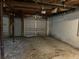 Unfinished basement garage with concrete floor at 6883 Lakeshore Dr, Douglasville, GA 30135