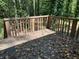 Deck with leaf covered wooden surface at 6883 Lakeshore Dr, Douglasville, GA 30135
