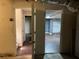 View of two unfinished basement rooms with doors ajar at 6883 Lakeshore Dr, Douglasville, GA 30135