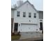 White brick two-story home with two-car garage at 3309 Cranston Ln, Kennesaw, GA 30144